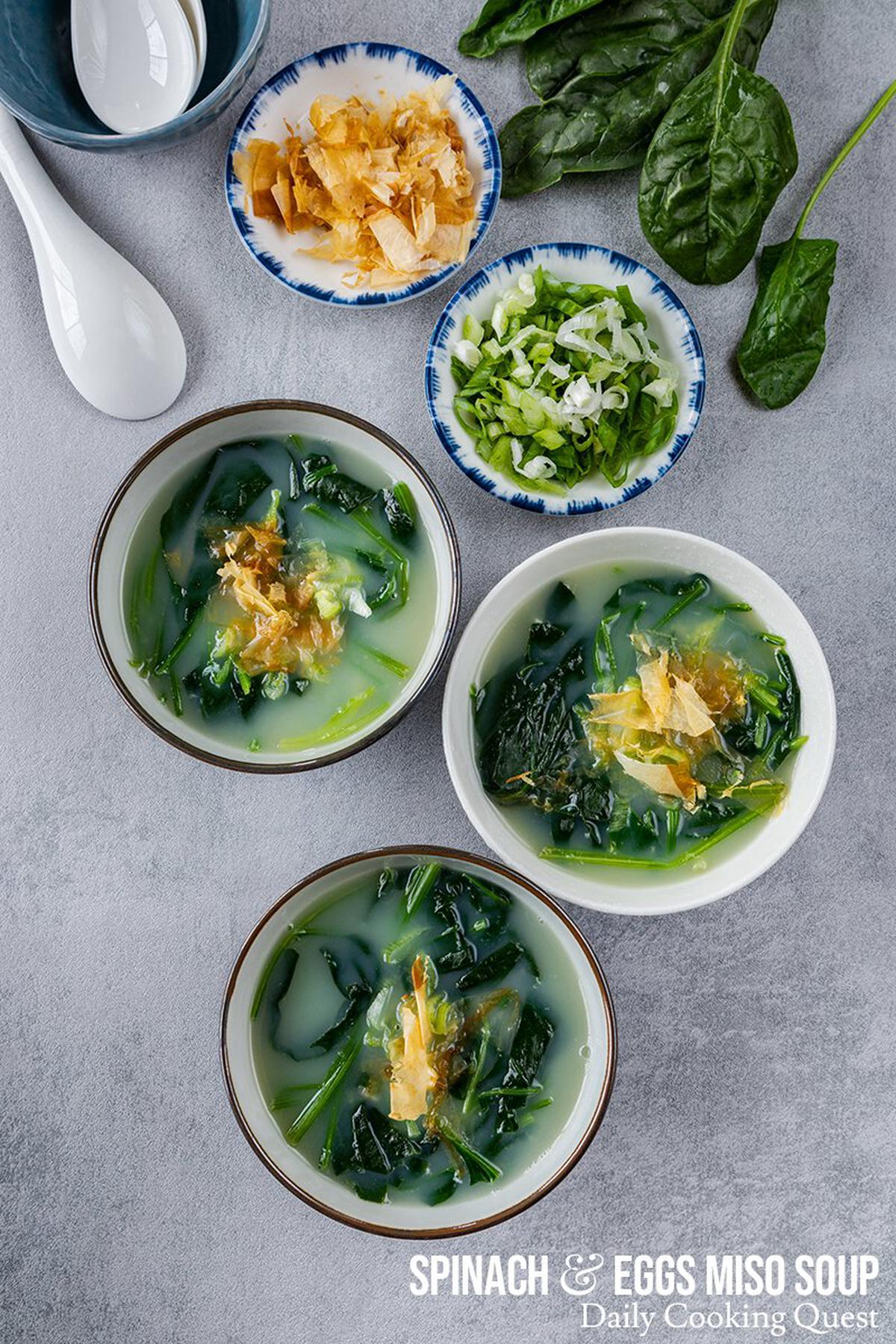 Serve spinach and egg miso soup hot, garnished with thinly sliced scallions and bonito flakes.