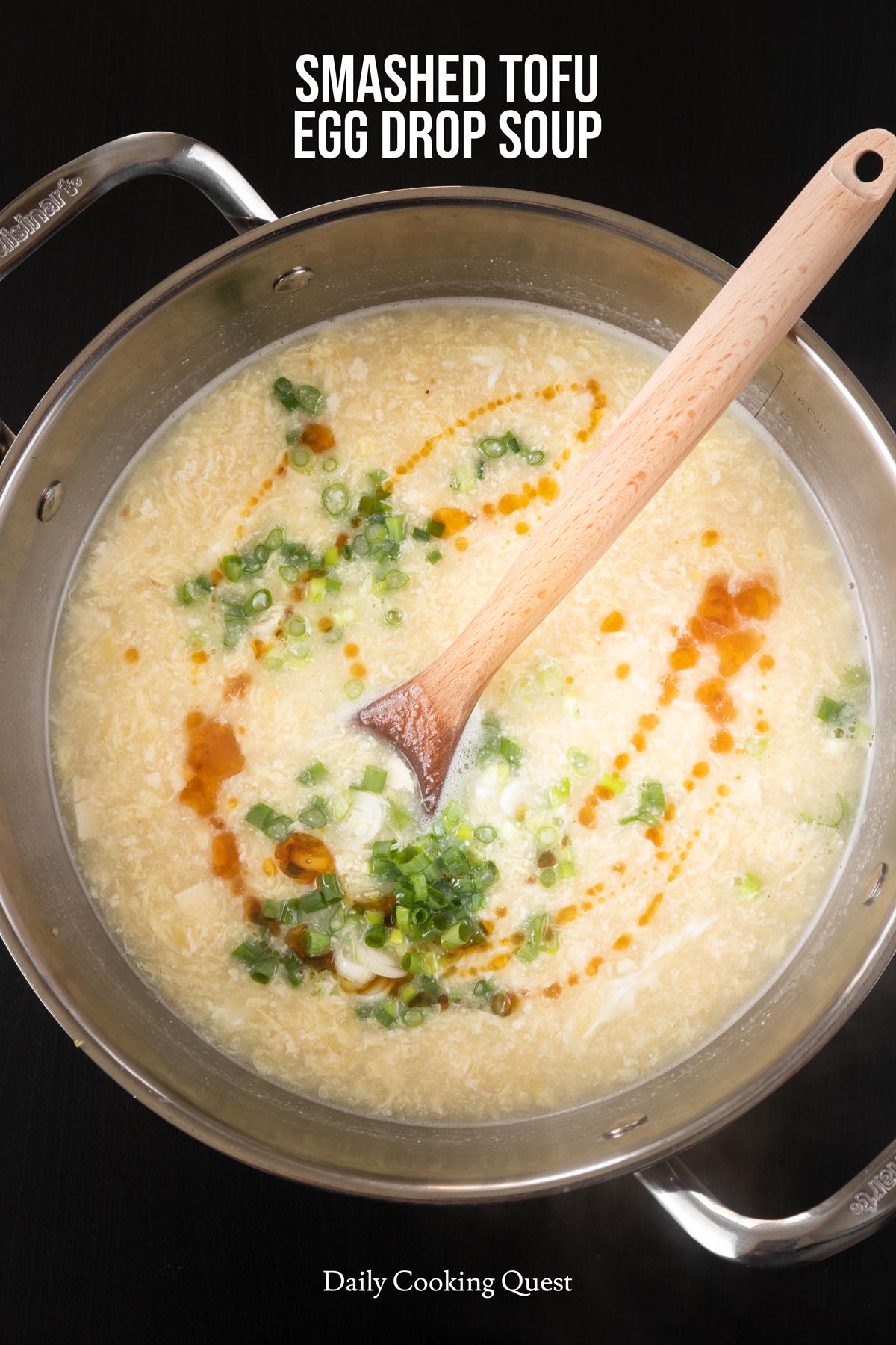 Garnish smashed tofu egg drop soup with thinly sliced scallions and sesame oil.
